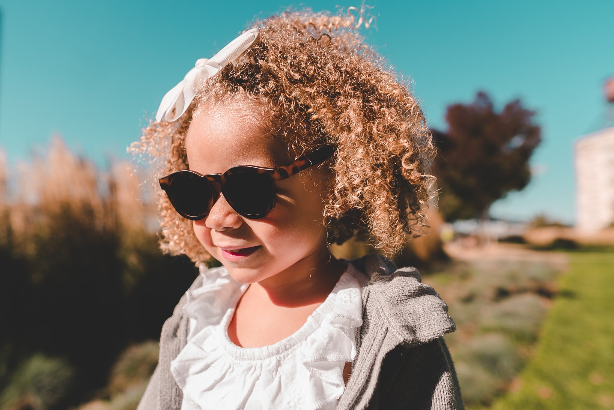 The Chill Sunglasses offer 100% protection against UVA/UVB rays Child wearing Real Shades Toddler Sunglasses