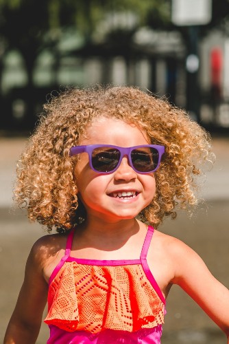 The Switch Sunglasses offer 100% protection against UVA/UVB rays Child wearing Real Shades Switch Sunglasses