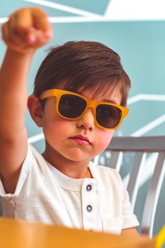 The Switch Sunglasses offer 100% protection against UVA/UVB rays Child wearing Real Shades Switch Sunglasses
